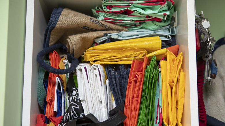 A number of folded reusable shopping bags