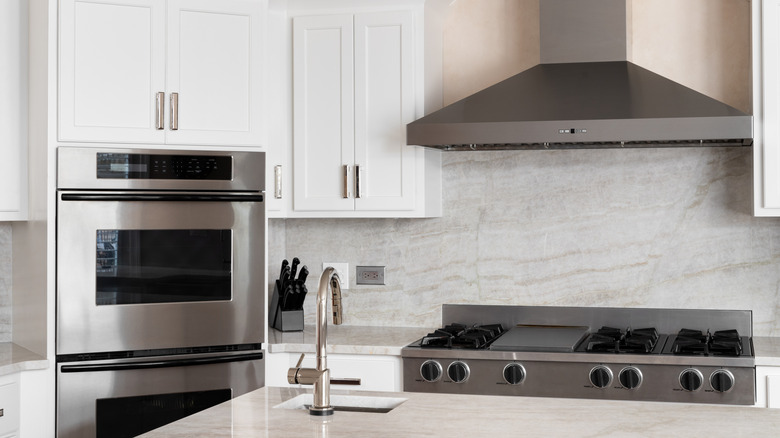 A kitchen with stainless steel appliances.