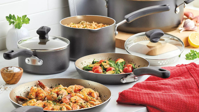 Faberware pots and pans, each containing freshly-cooked food