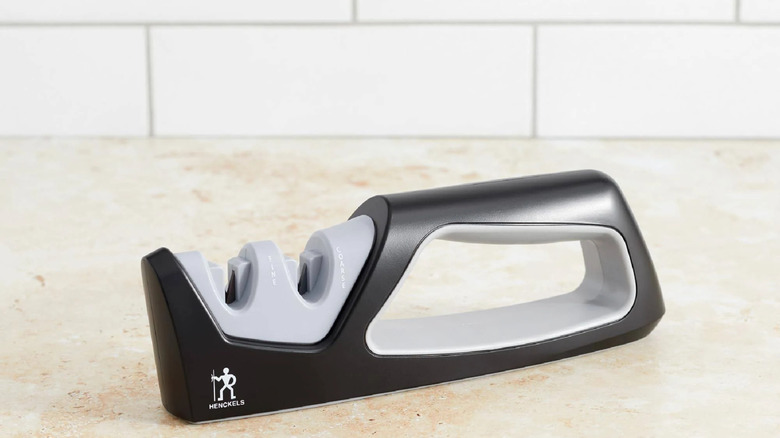 The Henckels Handheld Knife Sharpener, on a countertop