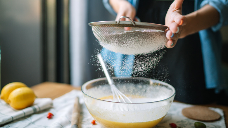 A sieve sifting flour