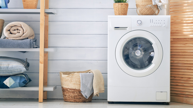 Laundry room with slatted door