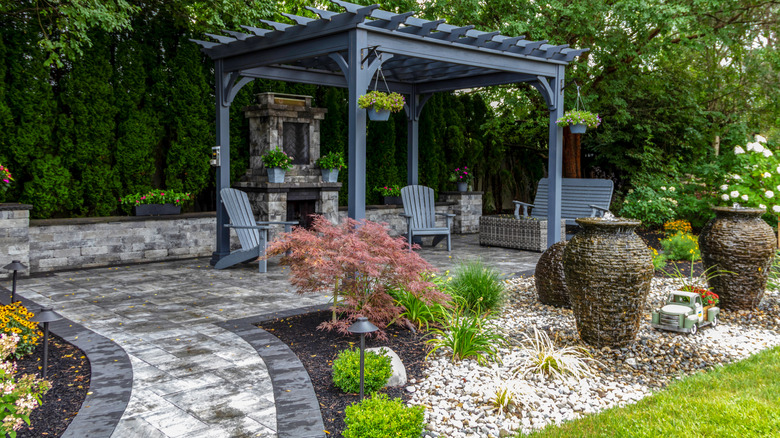 Backyard landscape with pergola and gravel garden