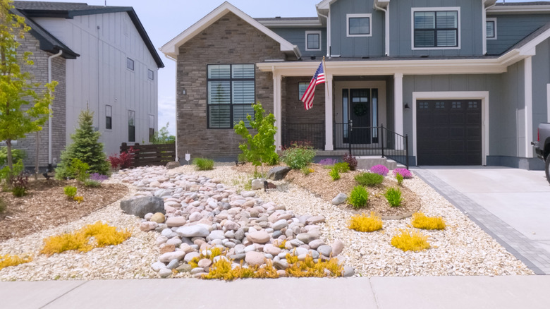 A xeriscaped garden in front of a house