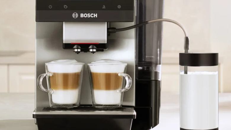 A Bosch dual automatic espresso machine with a steam wand for milk.