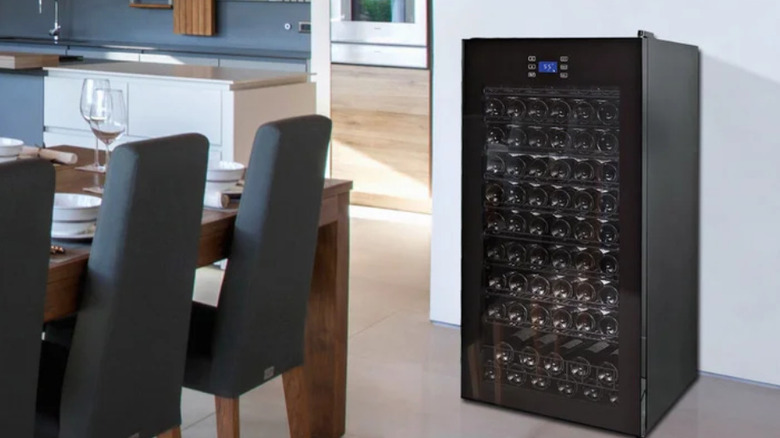 A free-standing Wine Enthusiast brand wine cooler in black.