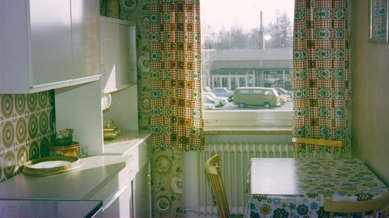 A narrow 1970s kitchen.