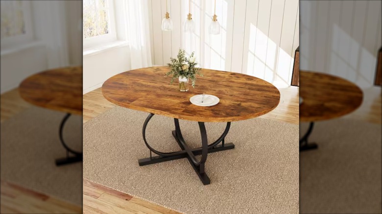 The 59-inch Modern Vintage Brown Dining Table from Home Depot in a dining room setting