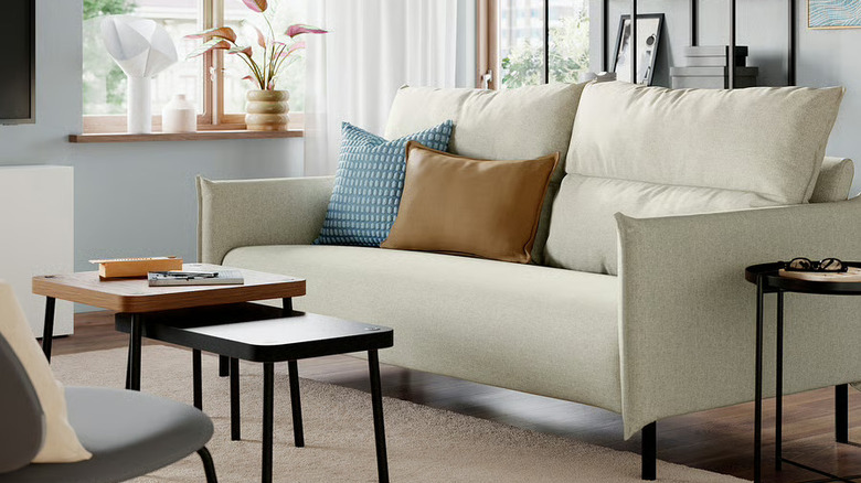The MANNARP three-seat sofa in a living room with decor