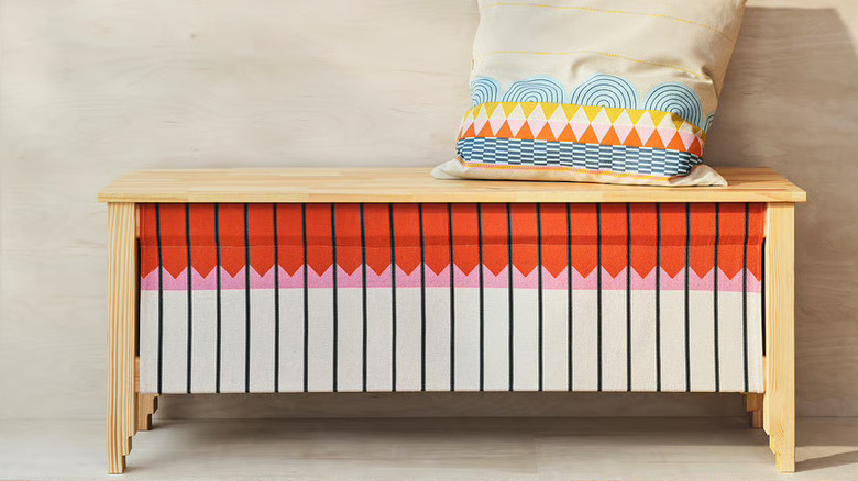 IKEA OMMJÄNGE Bench with a pillow on top against a neutral wall