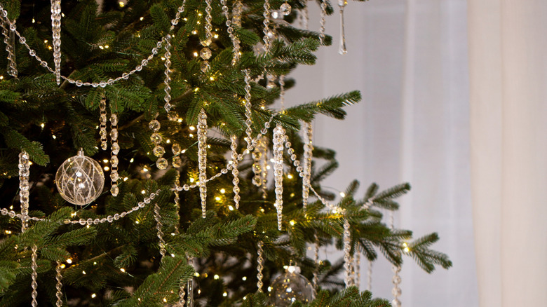 Icicle and crystal ornaments on a Christmas tree