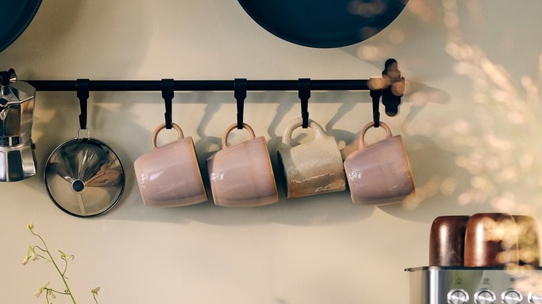 IKEA's HULTARP rail in kitchen with mugs