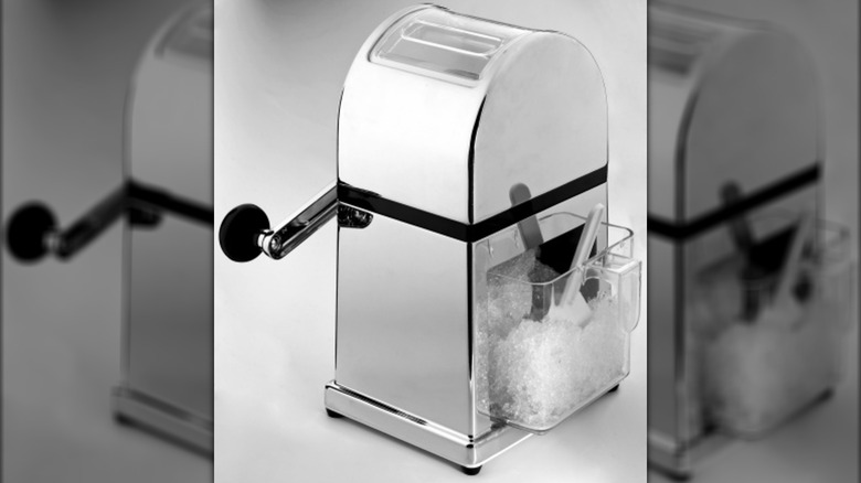 An old-school manual ice crusher