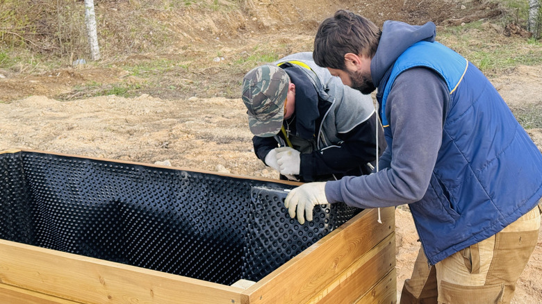 Putting a pond liner in a raised bed