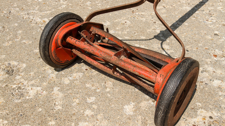 Close-up of an old push reel mower