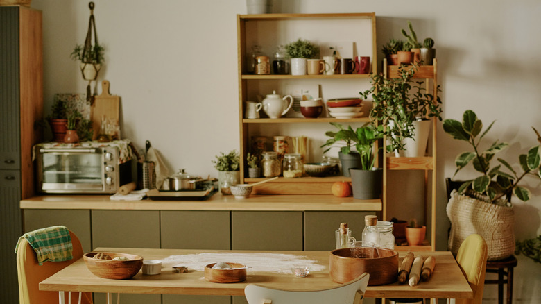 Cluttered kitchen with various home decor pieces