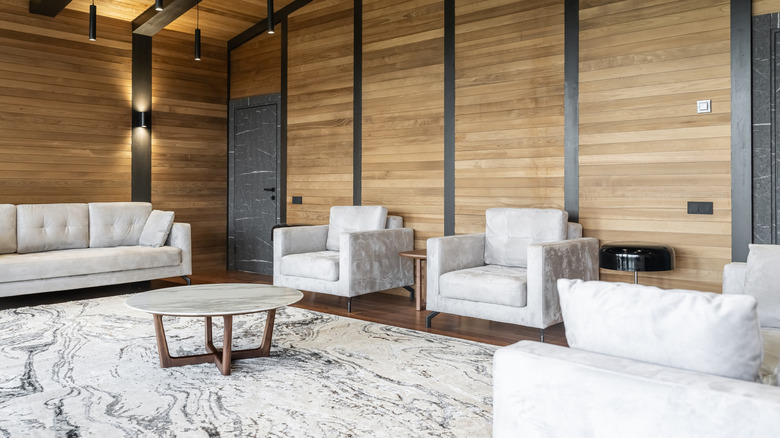 Living room with matching white couches and chairs