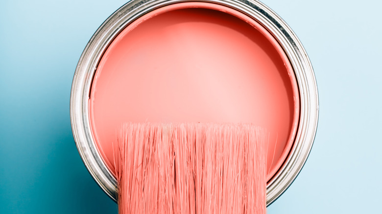 pink paint and brushes