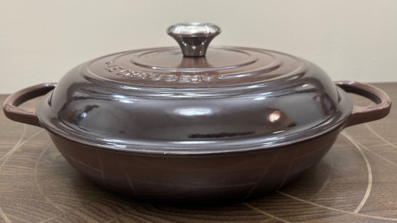 A Le Creuset braiser in Ganache, a chocolatey color that is discontinued