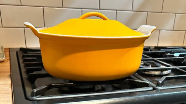 A rare Le Creuset casserole dish in the Pamplemousse color, a bright orangish yellow