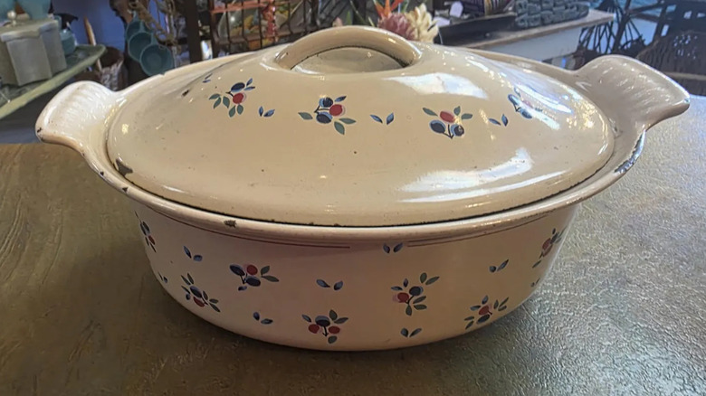 A Le Creuset lidded casserole dish decorated with the Petits Fruits pattern