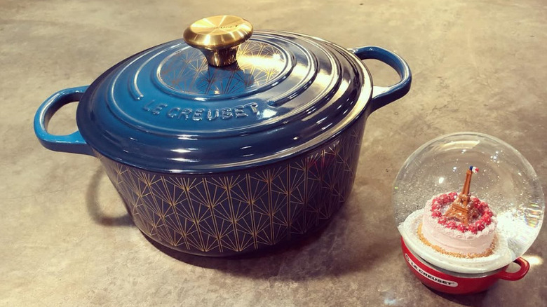 A limited edition Le Creuset Dutch oven with a teal and gold Soiree pattern