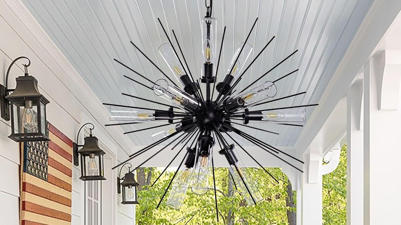 A black Sputnik chandelier on a porch.