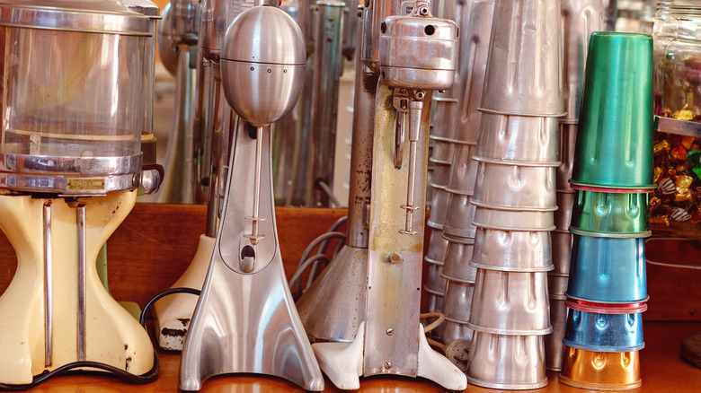 A row of retro milkshake making machines.