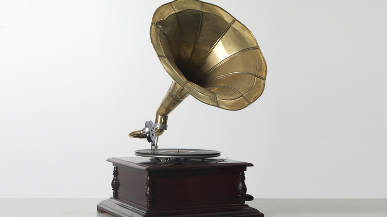 A vintage gramophone with a gold horn.