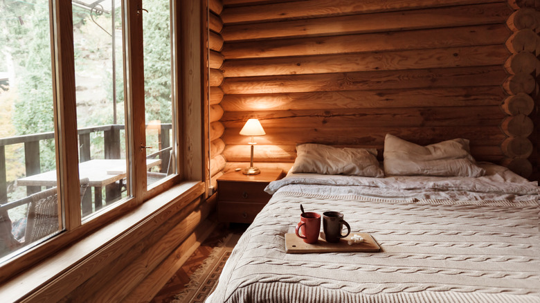 Log cabin bedroom and window