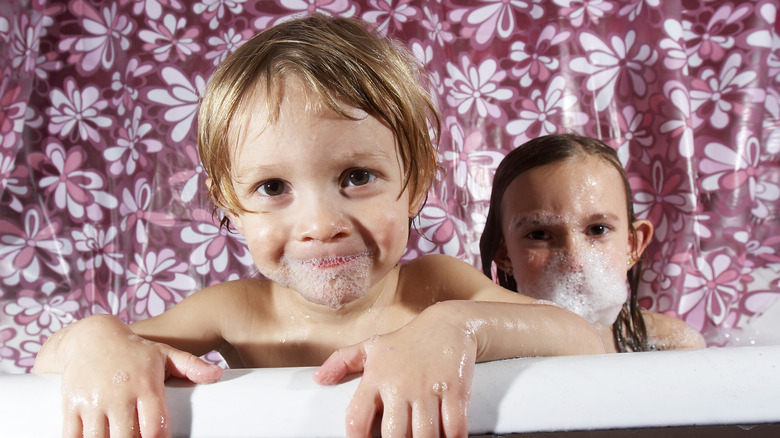 shower curtain behind kids 