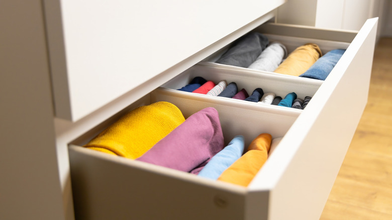 Dresser drawer divided by clothing type