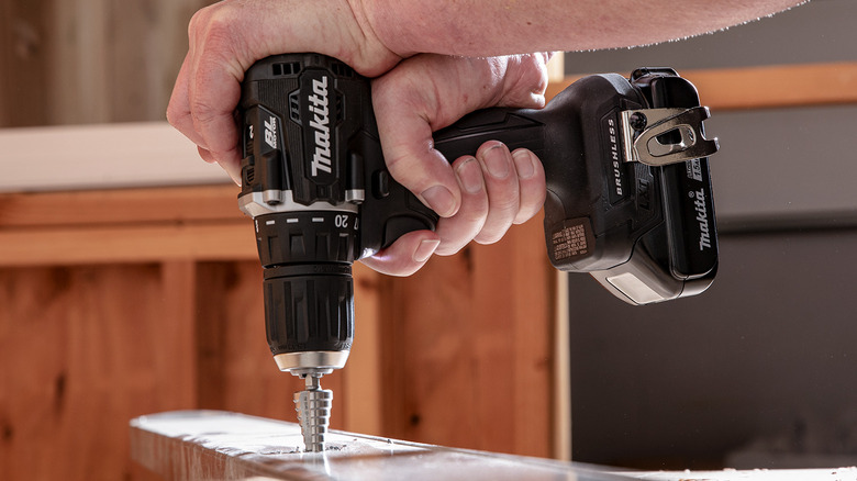 A person using Makita's 18V LXT Sub-Compact Lithium-Ion Brushless Cordless ½-inch Variable Speed Driver Drill Kit