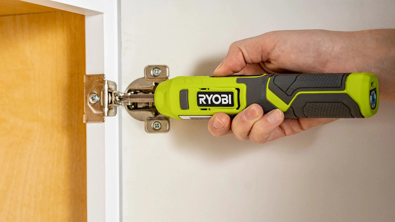 A person fastening screws with Ryobi's 4V Cordless ¼-inch Screwdriver