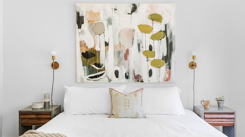 White bedroom with painting