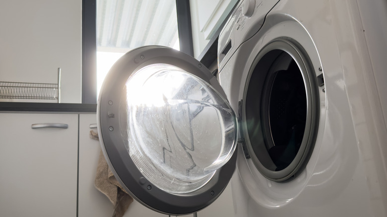 Open drum on a white washing machine