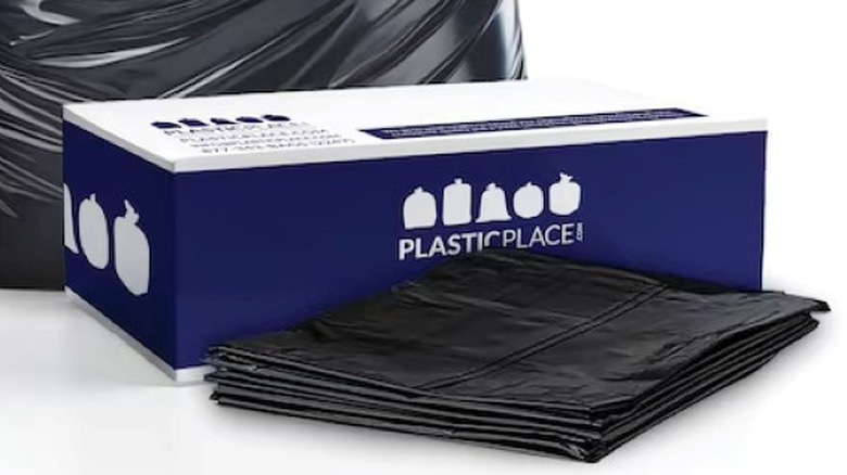 Plasticplace's Contractor 55-Gallon Black Outdoor Plastic Construction Twist Tie Trash Bags on a white background