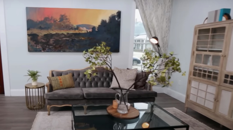 vintage couch with colorful artwork