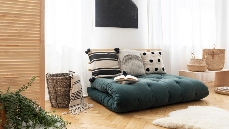 Folded green futon cushion 