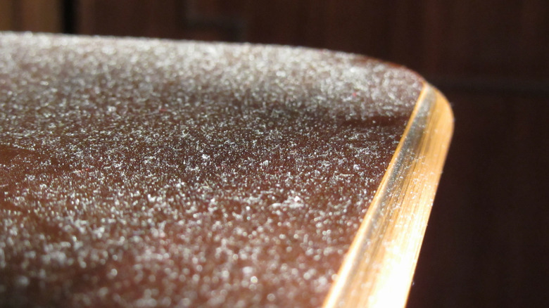 A dusty wooden surface
