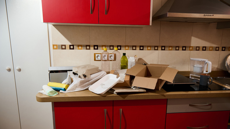 A cluttered kitchen countertop