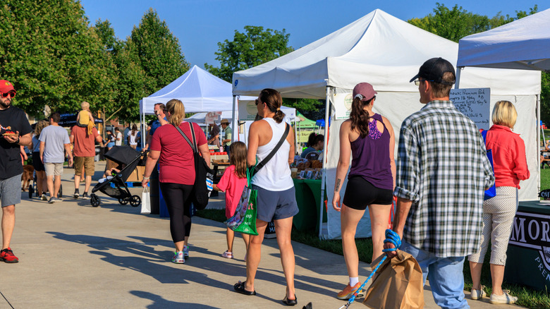 Shoppers at a farmers market in Fishers, Indiana