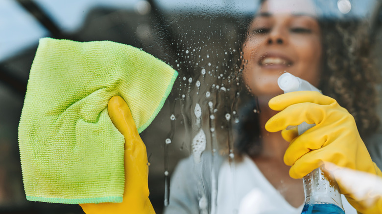 Closeup of a woman cleaning windows