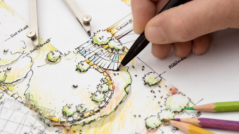 A landscape architect sketching plans for a garden