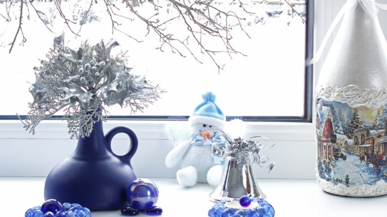 A deep blue base with blue crystal winter decor
