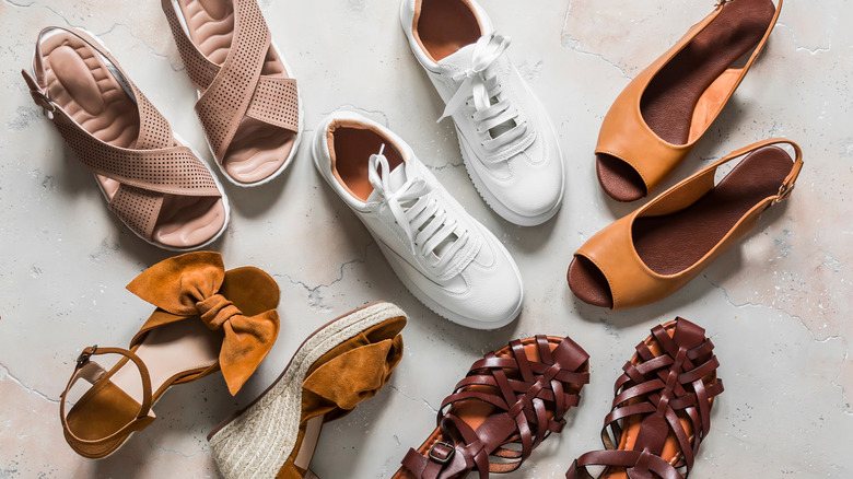 sneakers surrounded by heels