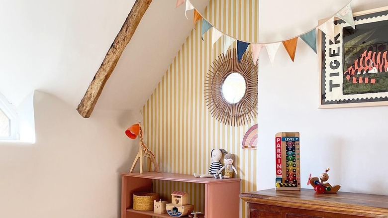 Yellow striped wallpaper in a recessed nook