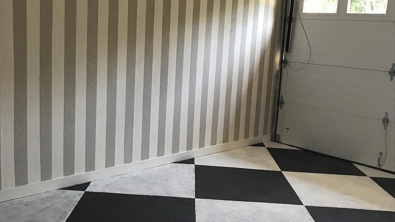 Vertically striped garage walls with checkered flooring