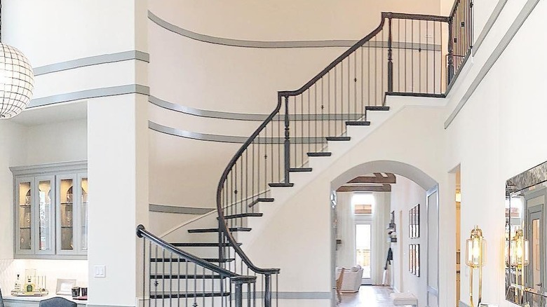 Metallic trim lining an entryway staircase