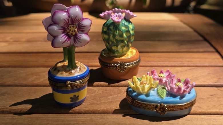 Set of porcelain Limoges trinket boxes on a table